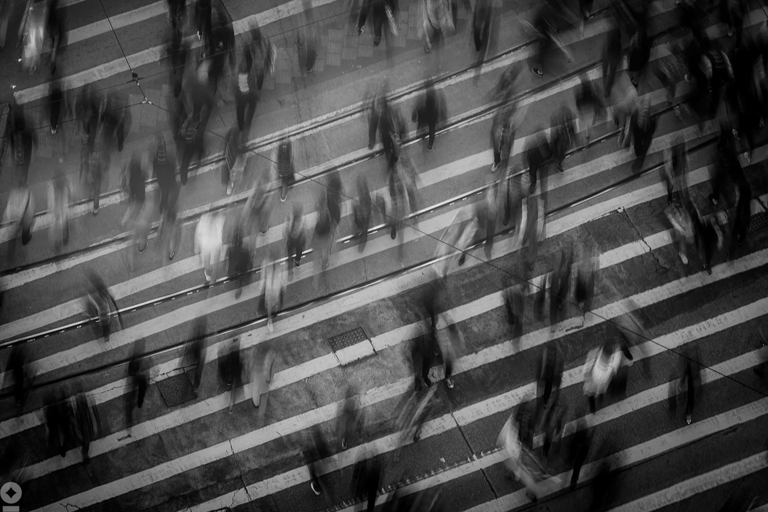 American flag flying over government building in city, blue sky and clouds