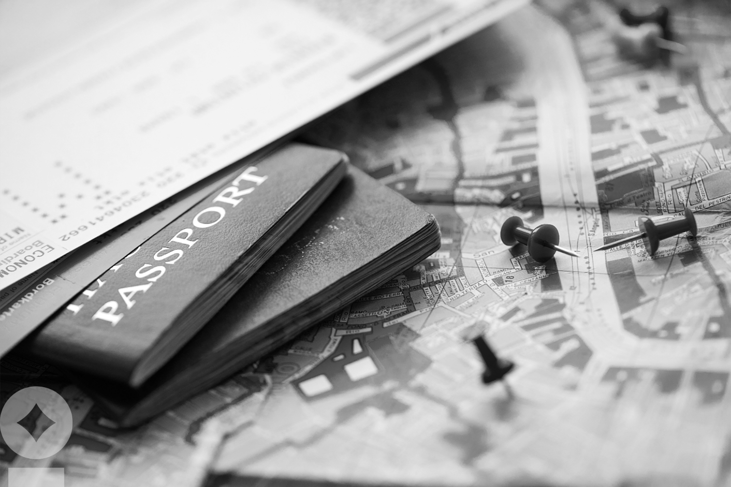 American flag flying over government building in city, blue sky and clouds