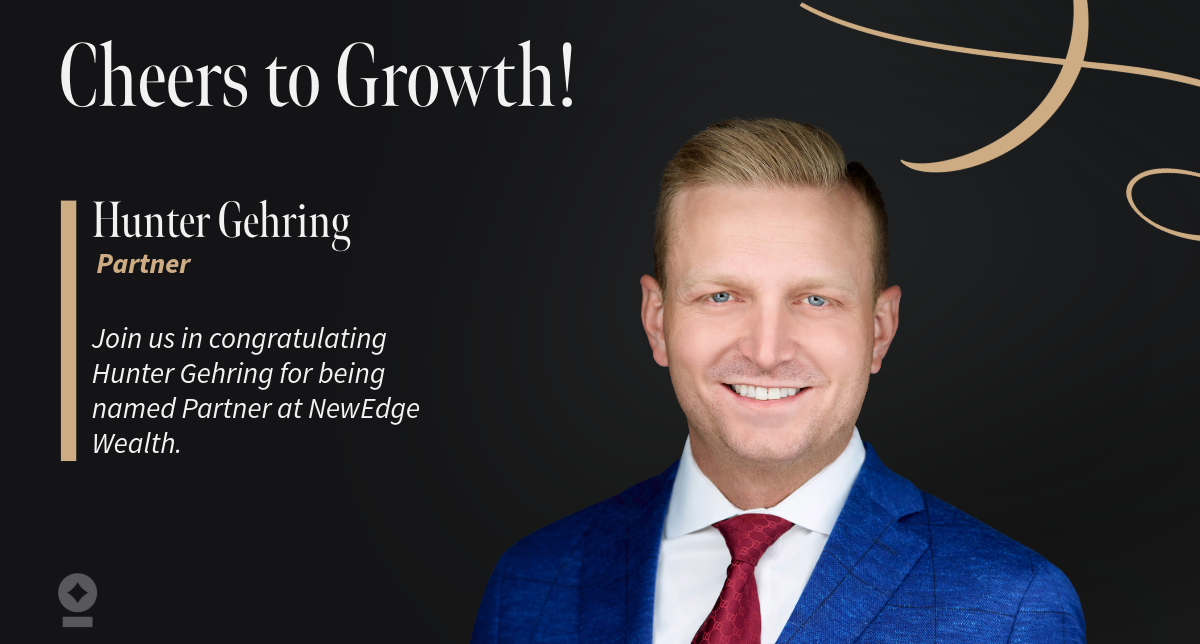 American flag flying over government building in city, blue sky and clouds Hunter Gehring Named Partner at NewEdge Wealth