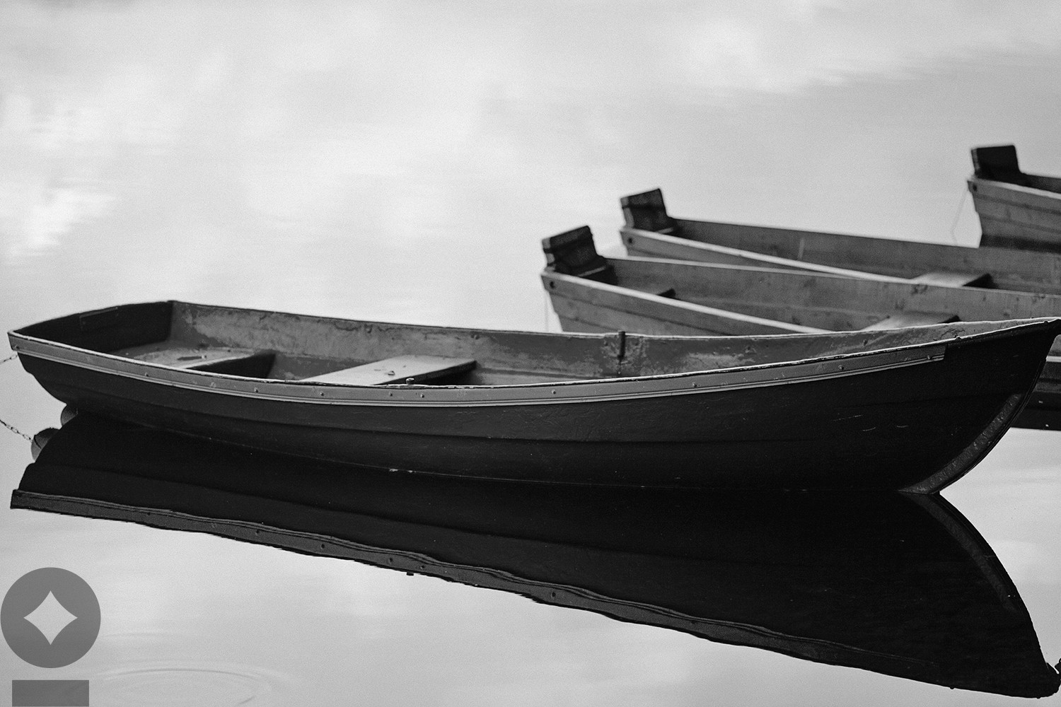 American flag flying over government building in city, blue sky and clouds