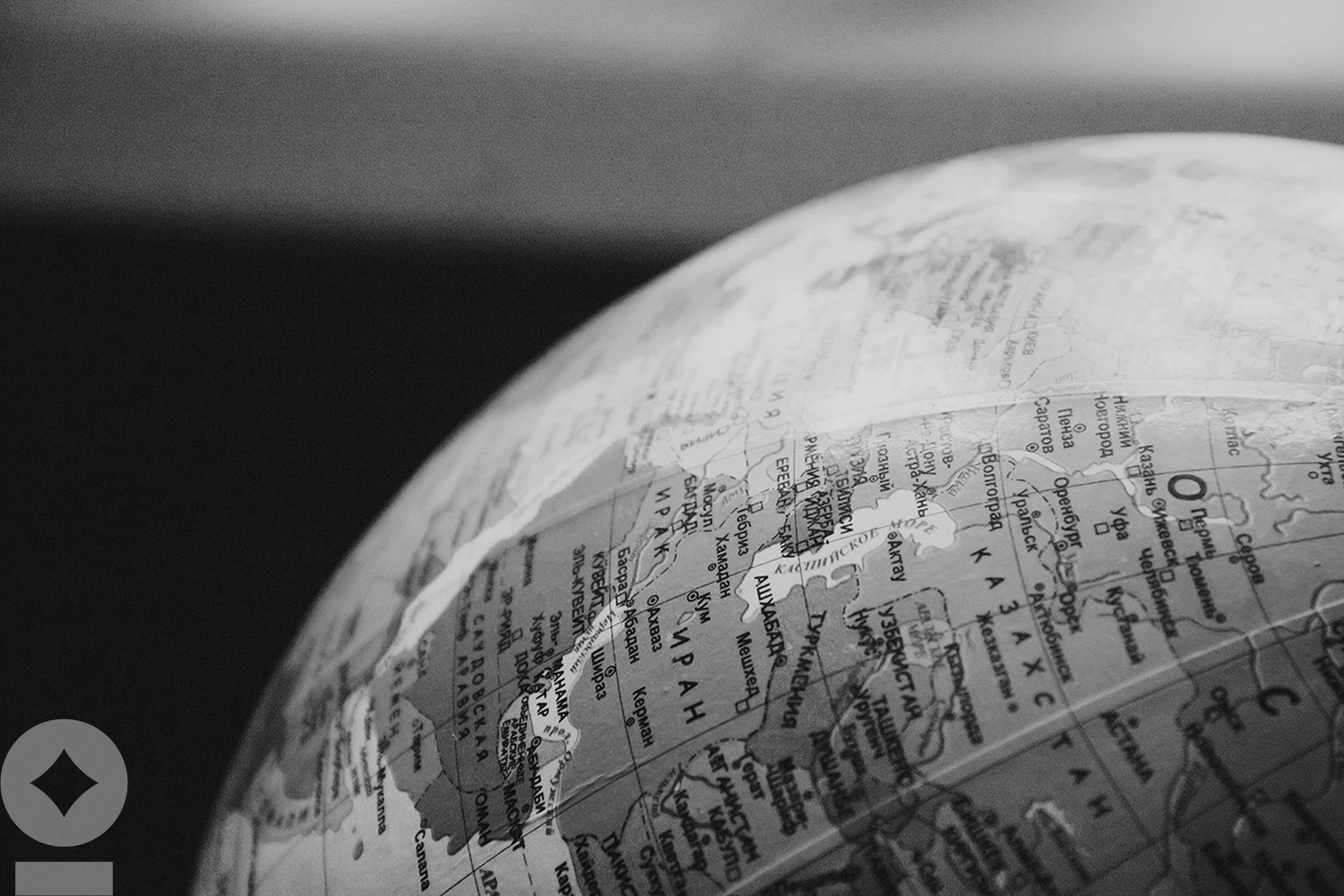 American flag flying over government building in city, blue sky and clouds