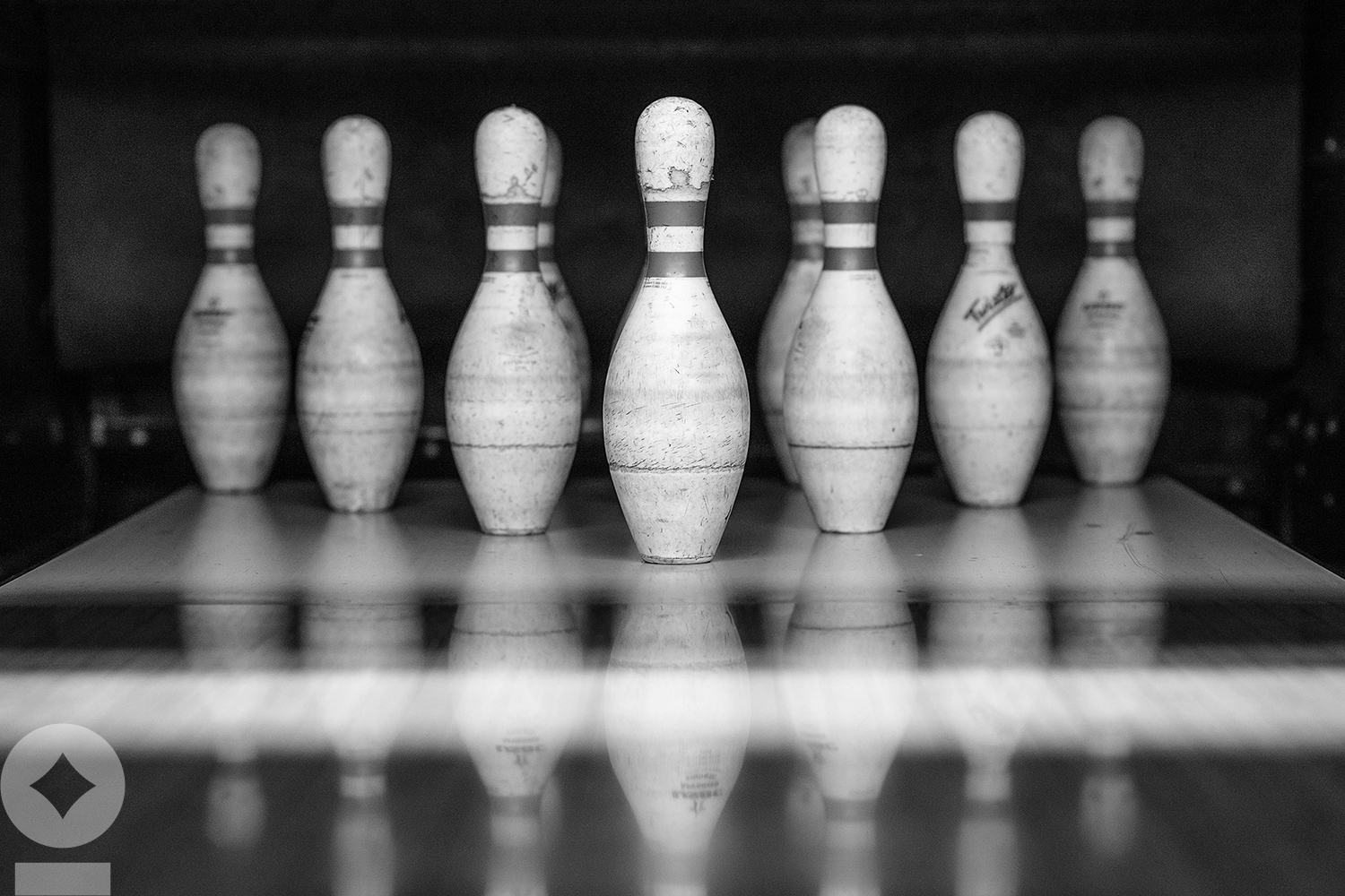 American flag flying over government building in city, blue sky and clouds