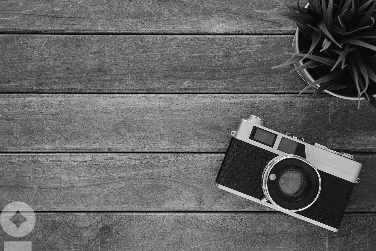 American flag flying over government building in city, blue sky and clouds